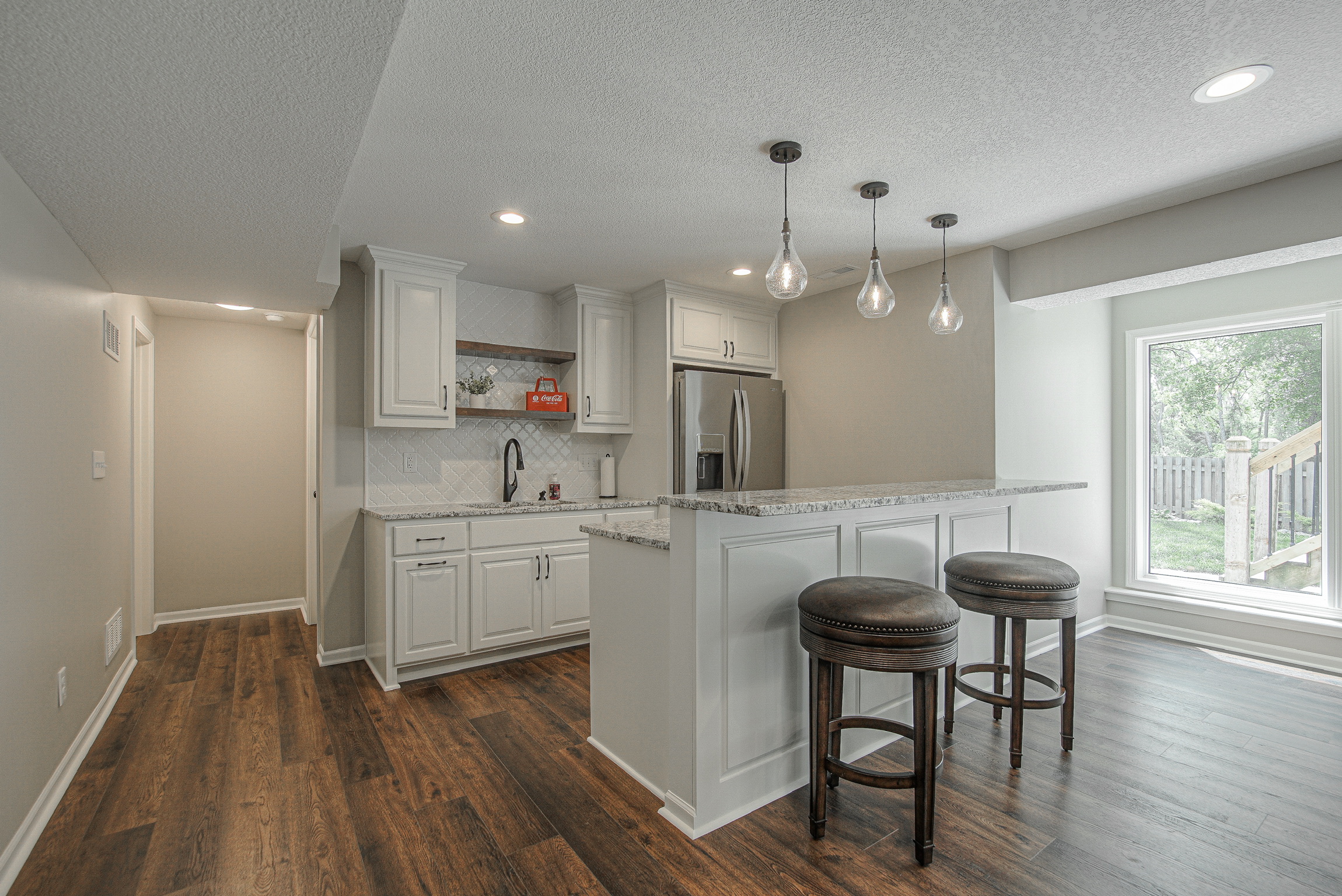Bright modern kitchen with island and stools